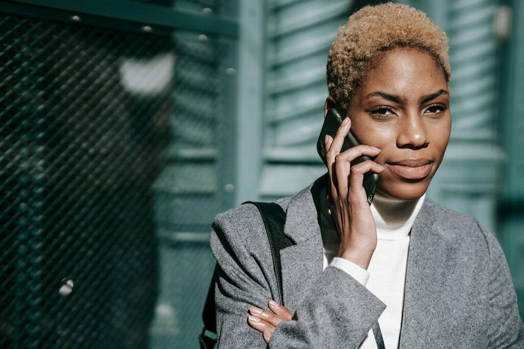 African American woman on a phone call in the street